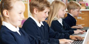 primary school children using laptop computors supported by blueorange it